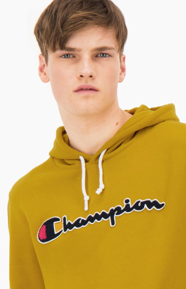 Sudadera CHAMPION Hombre con capucha Terry Hoodie 213498-YS071 amarillo mostaza | Martimpe - Tienda Moda en Gausach, Vielha, Valle de Aran