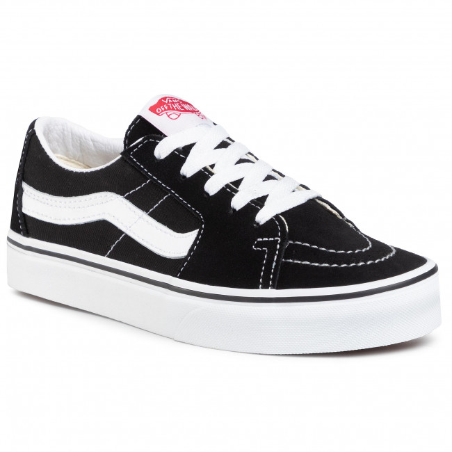 Vans negras store con raya blanca