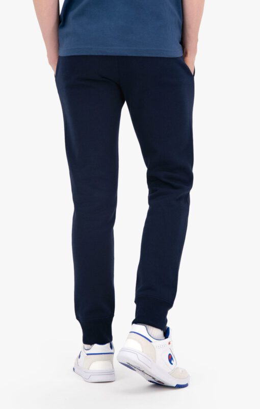 Pantalón Chándal CHAMPION Hombre ORGANIC COTTON BLEND SMALL SCRIPT LOGO JOGGERS Ref. 216479 Azul marino